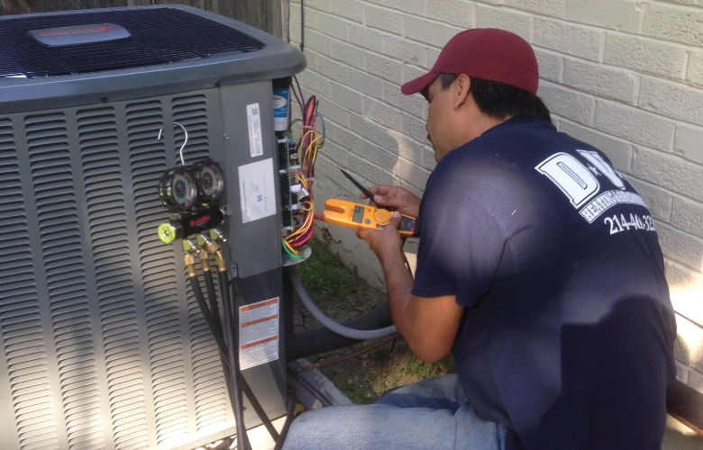 DVO technician servicing air conditioning unit in Mesquite, TX