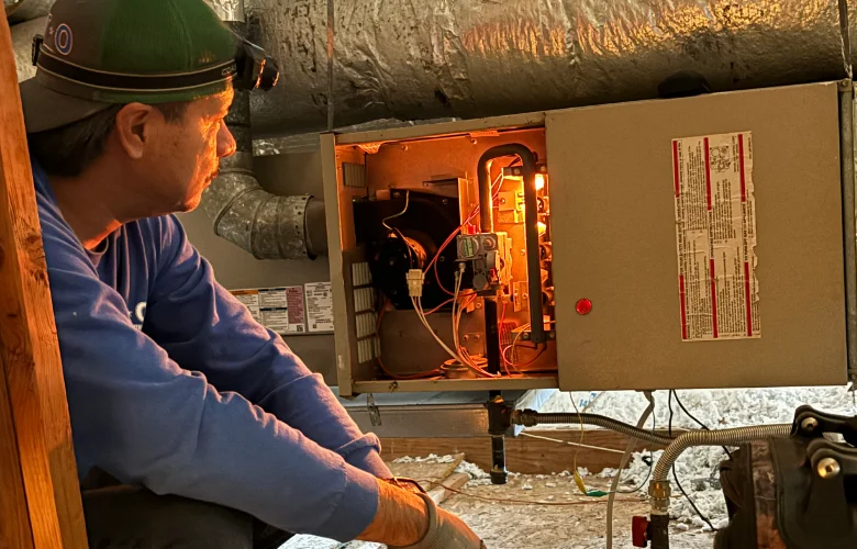 DVO technician servicing furnace unit in Mesquite, TX